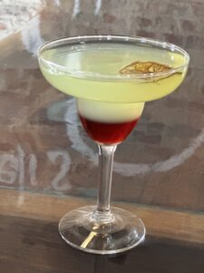 Refreshing and zesty cocktail with a heavenly twist - Angel's Margarita featuring tequila, fresh lime juice, agave nectar, and a hint of orange liqueur. Garnished with a lime wheel and a sprig of fresh mint. A divine blend of sweet, sour, and tangy flavors that will transport you to cocktail bliss."